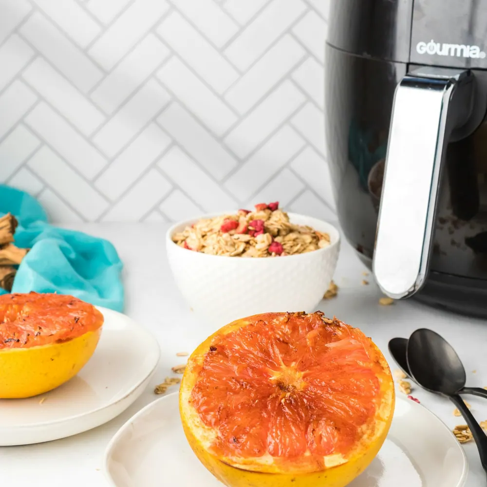 Fernbrook Crisp 6-quart air fryer on a kitchen counter beside a prepared meal