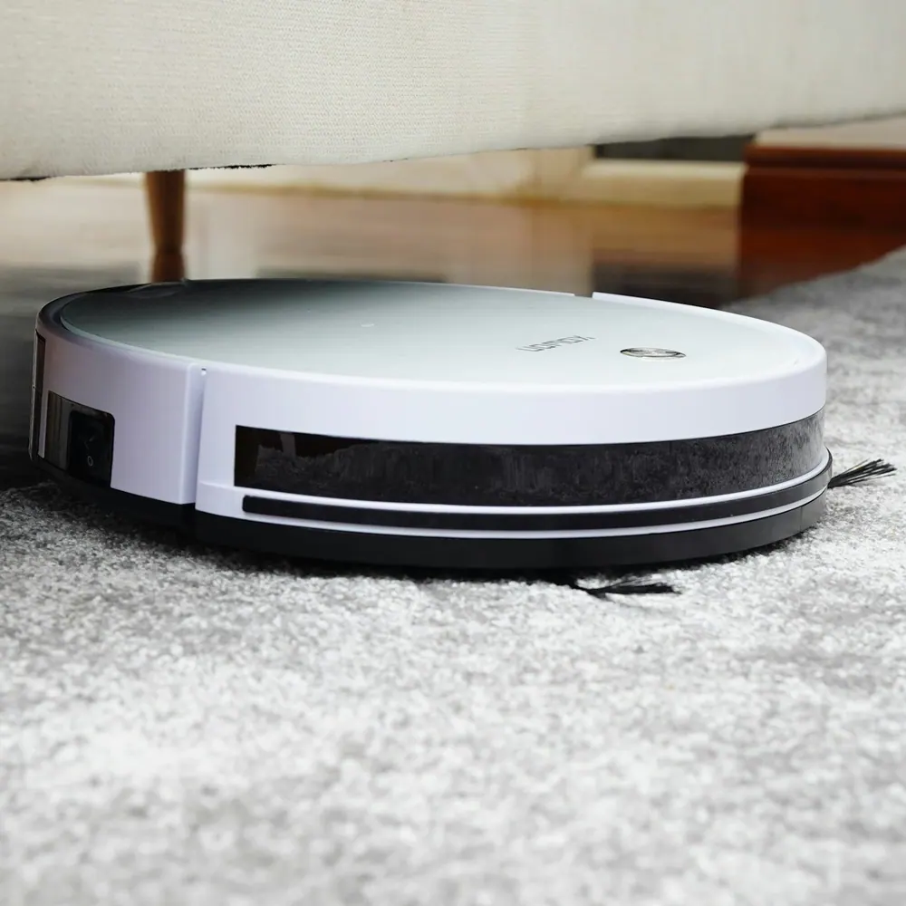 Fernbrook Sweep robot vacuum with mop attachment on a hardwood floor
