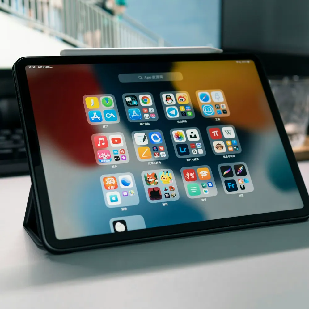 Kestrel Slate 11 tablet propped on a stand with its keyboard folio