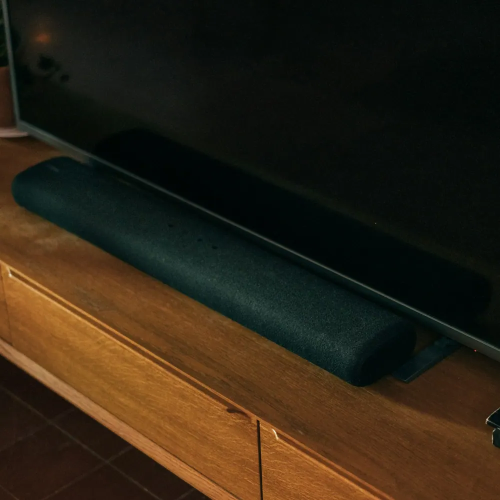 Lumen Bar 320 Dolby Atmos soundbar with its wireless subwoofer