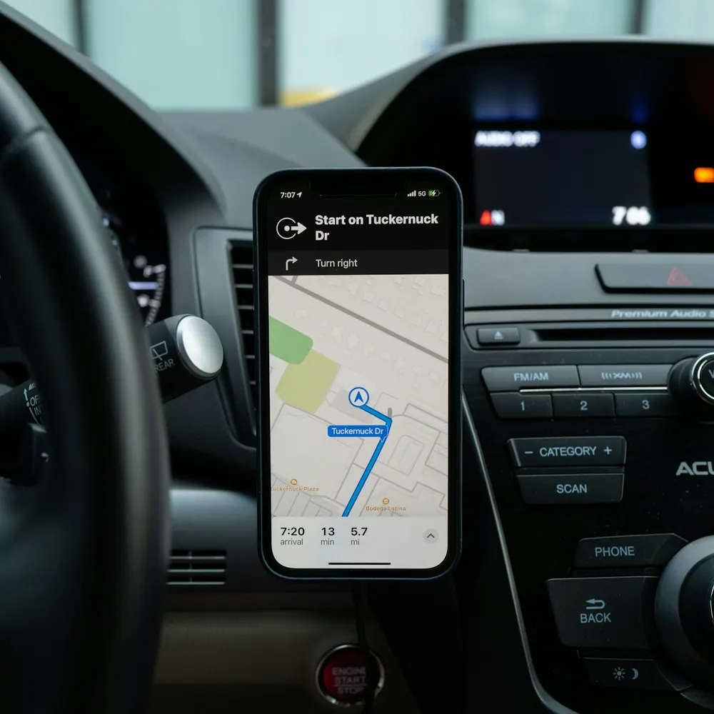 Nimbus Drive magnetic car mount holding a phone running navigation in a car