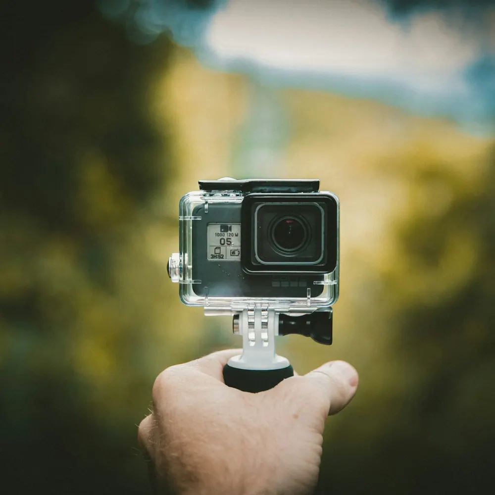Northgate Scout 4K action camera held in one hand outdoors