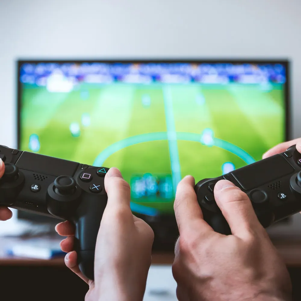 Riftline Pro hall-effect controller held in both hands during a game