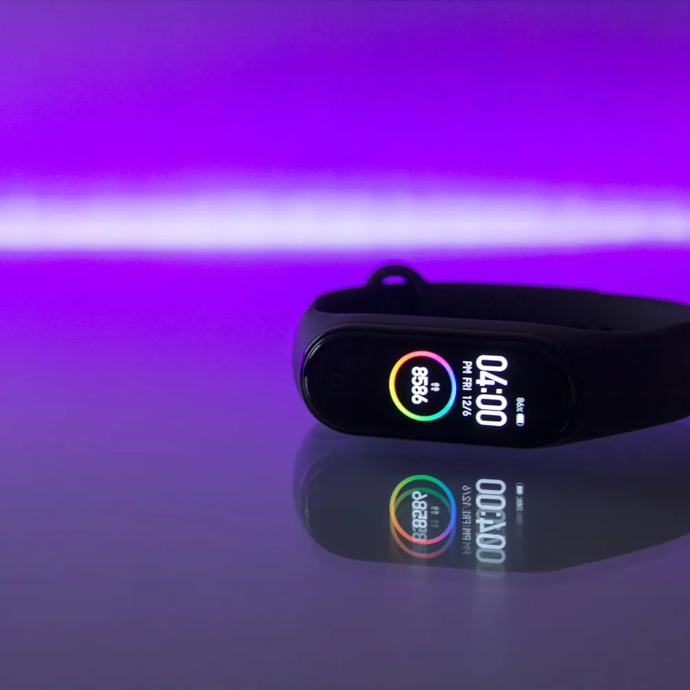 Trailhead Pulse fitness band on a wrist showing step count