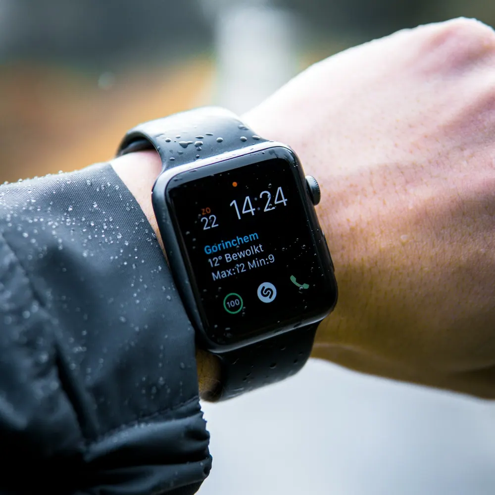 Trailhead Summit GPS smartwatch worn on a wrist showing the time